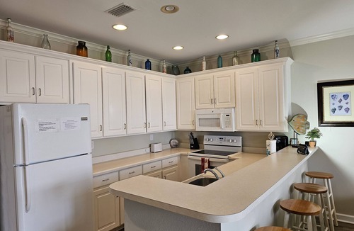 Dauphin Island Condo | Dauphin Island Beach Club 101A Walk right out to Pools and Beach!