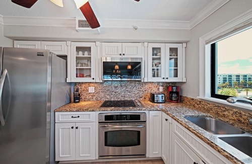 New Smyrna Beach Condo | Direct oceanfront corner condo with a large wrap around balcony and heated pool