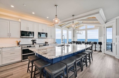 Yaupon Beach House | Discover Suite Emotion: an oceanfront retreat in Oak Island with 14 spacious bedrooms.