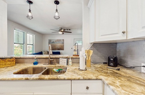 Riverside Heights House | Dog-friendly bungalow with a fenced yard, deck, washer/dryer, & AC