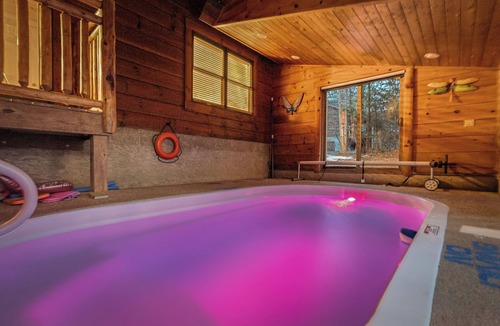 Sevierville Cabin | Dog Friendly! Private Indoor Pool, Hot Tub, GameRoom, Firepit & Free Passes.