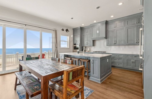 Ocean Cay House | Experience oceanfront luxury at 1088 S. Fletcher Ave, a spacious 5-bedroom house