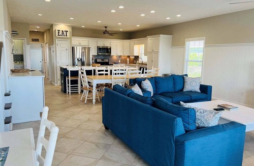Holden Beach House | Experience oceanfront luxury at FINS, a spacious 10-bedroom retreat in Holden Beach.
