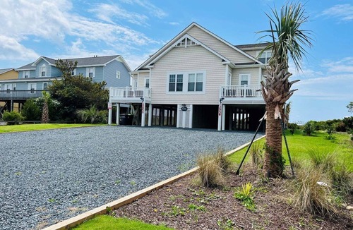Holden Beach House | Experience oceanfront luxury at FINS, a spacious 10-bedroom retreat in Holden Beach.