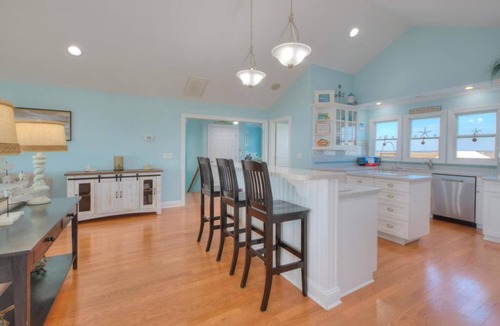 Caswell Beach House | Experience oceanfront luxury at Sea for Miles in Oak Island, NC, with 5 bedrooms!