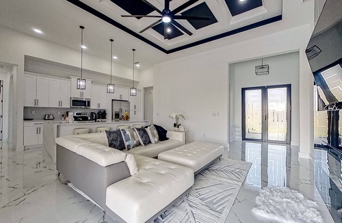 Diplomat House | Exquisite riverfront home with pool, lanai, fireplace, W/D, 7 dog-friendly