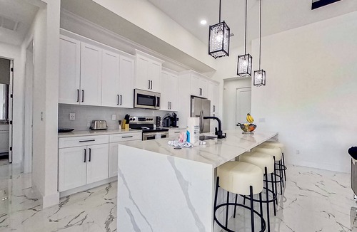 Diplomat House | Exquisite riverfront home with pool, lanai, fireplace, W/D, 7 dog-friendly
