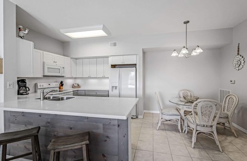 Iona Condo | Gardens at Beachwalk Close To Beaches; Walking Distance To Shops & Restaurants