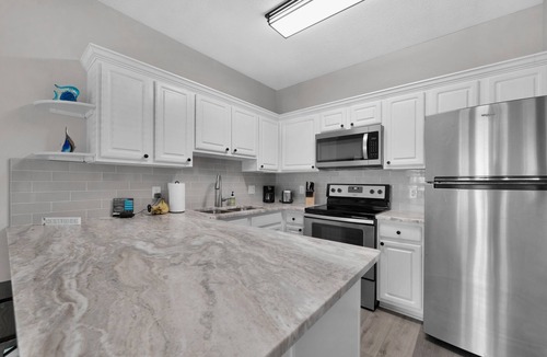 Crystal Shores Condo | Gulf Views * Steps to the Beach * Private Patio