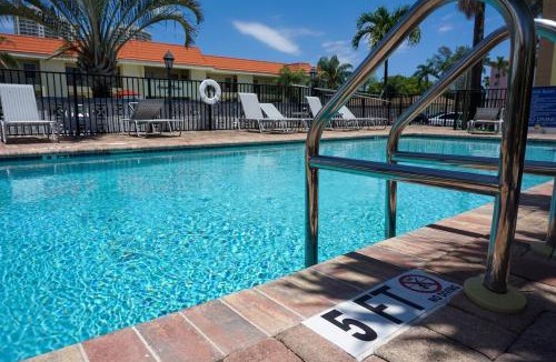 Palm Beach Shores Apartment | Haven - Walk to the Beach, Free Bikes, and Pool!