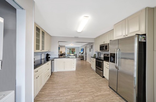 Melaleuca Gardens House | Home on Canal Unit B by PMI