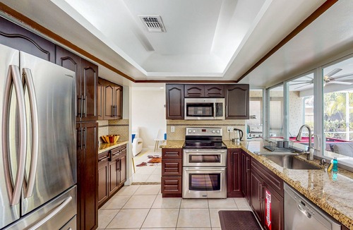 Hollywood Hills House | Ideally located home with enclosed pool, grill, W/D, & AC - snowbird-friendly