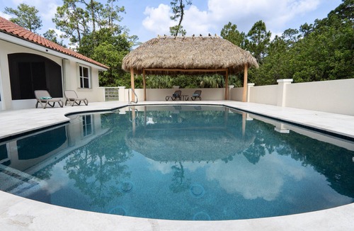 Jupiter Farms House | JUPITER FARMS TIKI PARADISE! Private, heated pool, Monarch Butterfly Waystation.