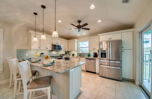 Beachview Country Club Estates House | Key West appeal & gorgeous Sanibel River views& bicycles -Villa Calypso Tides- Roelens Vacations