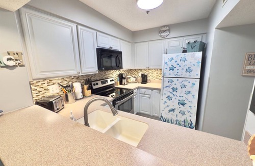 Arcadian Shores Condo | Kingston Laurel 210 2nd floor Elevator,Pool,Beach