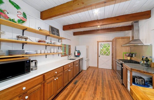 Tiger House | Lakefront 4BR, 4.5BA retreat with boathouse, fire pit, and serene Lake Burton views.