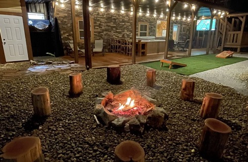 La Follette Cabin | Lakefront, covered dock, hot tub, game/pool rm, 4wd trails, firepits, 22 people