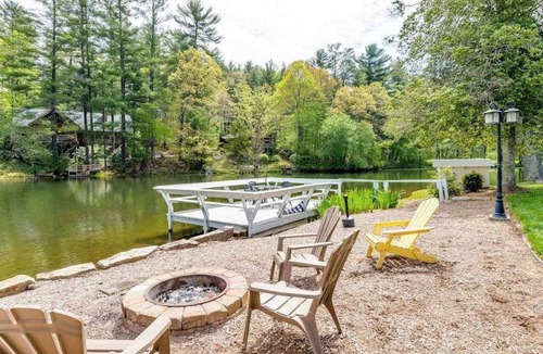 Flat Rock Condo | Lakeview pet friendly studio with pool, fire pit, canoes & paddle boats, & WiFi
