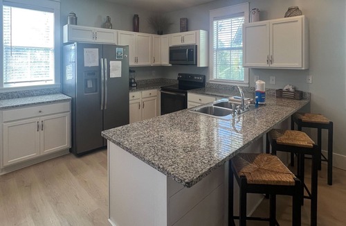 Port St. Joe House | Lovely cottage with screened porches - access to hot tub & gym