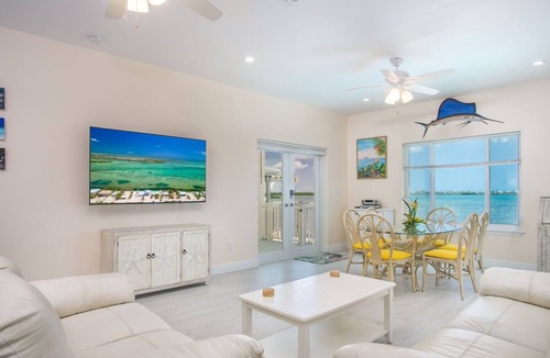 Breezeswept Beach Estates House | Low Key Sunrise: Waterfront pool home