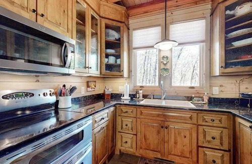 Highlands House | Luxe home overlooking Blue Valley & a stream with elevator & designer interior
