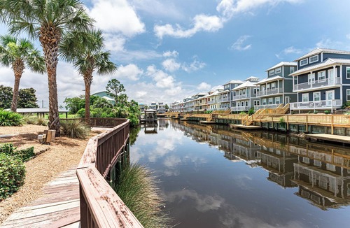 Waterside Village House | Luxurious House on the Canal, Pool, Hot Tub, steps to BEACH