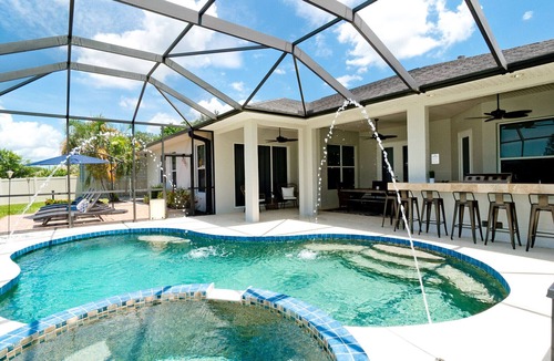 Trailer Estates House | Luxury 4 BR/3BA Waterview Home w/Pool + Spa with work space