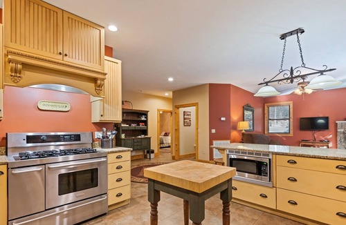 Bryson City Cabin | Luxury Creekside Lodge with Hot Tub & Game Room, Great for Large Groups!