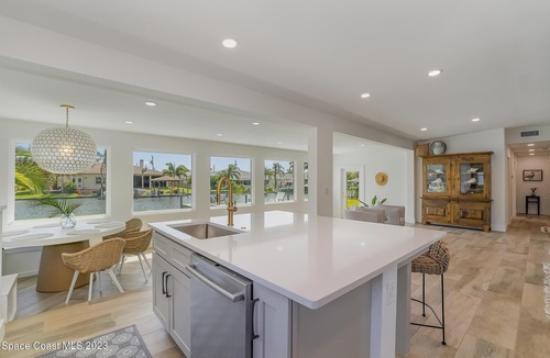 Cocoa Beach House | Luxury Waterfront -Heated Pool, Dock, Bikes & Paddleboards - Mins to Beach