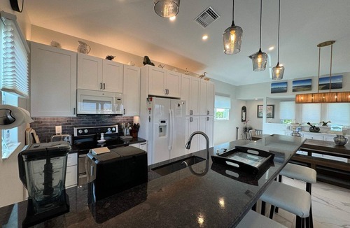 North Captiva House | Manatee Haven: Screened-in Pool, Spa and Elevator! 2 Golf Carts