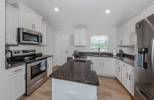 South Venice House | Modern Tropical Retreat, Heated Pool, Minutes to Beaches & Trails!