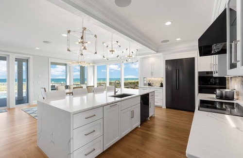 Kure Beach House | NEW! Ocean Front luxurious 6 bedroom home Pool, Elevator, and on the Beach!