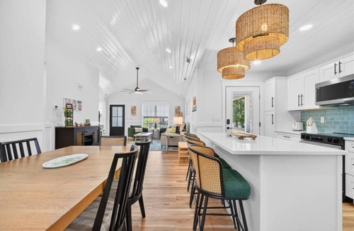 Tranquil Harbour House | Oak Island Lux Cottage | Fenced Yard & Heated Pool!