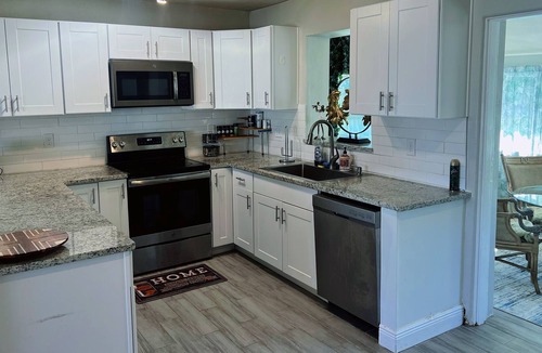 Pine Hills House | Orlando pool house 4BR near Universal Studios, Downtown, Arcade game