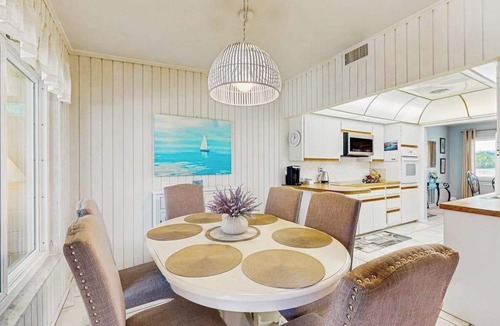 Englewood South House | Outdoor paradise on waterway with pool and spa, beach gear, and dog friendly