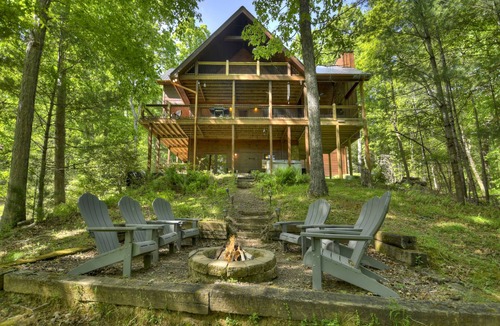 Cherry Log Cabin | Papa Bear Lodge is a Pet-friendly haven featuring hot tub, outdoor fireplace, firepit, pool table, WiFi, and secluded ambiance for unparalleled relaxation