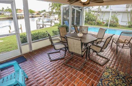 Mid Island House | Peaceful, spacious canal-front home w. private screened-in pool