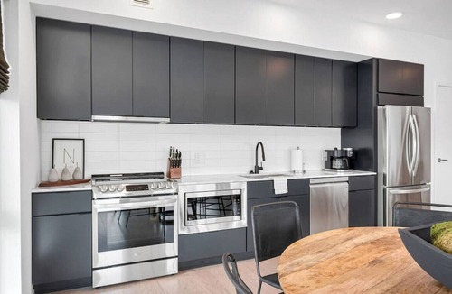 North Capitol Condo | Penthouse Condo with a River View - Walk to Downtown + Garage Parking