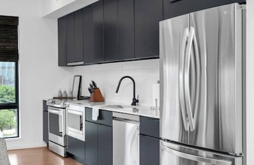 North Capitol Condo | Penthouse Condo with a River View - Walk to Downtown + Garage Parking