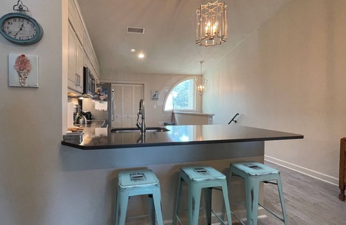 Sandestin Condo | Perfectly located home with golf cart, open layout, smart TVs, W/D, & pools