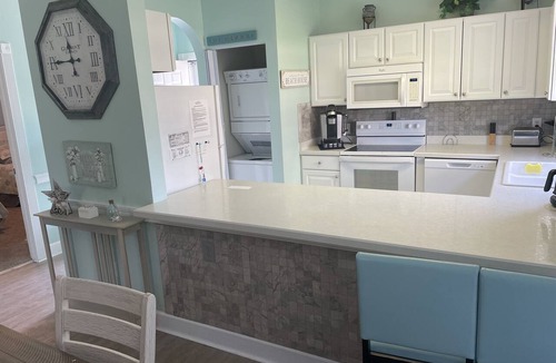 Central Myrtle Beach Condo | Pet Friendly 2 BR - Golf Course View! 1st Floor with screen door off back porch
