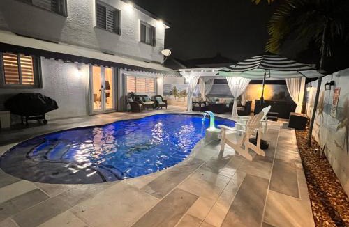 Country Walk House | PoolSide Vacation Home with Theater Gameroom