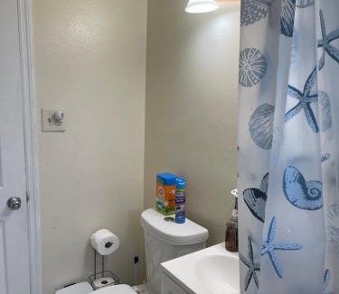 Fort Pierce North House | Private Queen Bedroom C shared common spaces