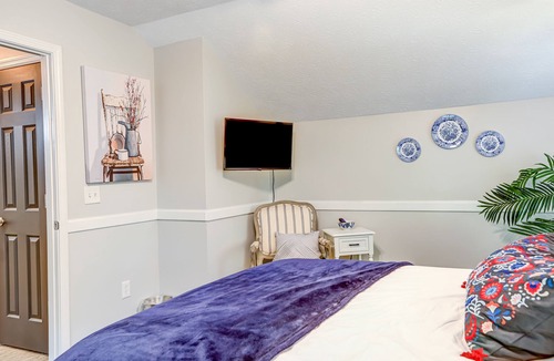 Epworth Cottage | Quaint wooded escape with wraparound deck, firepit, & fast WiFi - dog-friendly