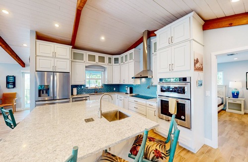 Islamorada House | Radiant waterfront retreat with remarkable views, patio, tennis court, & grill