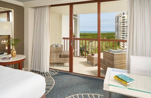 Pelican Bay Resort | Relax in Three Relaxing Rooms with Balcony, Beach & Outdoor Pool Access