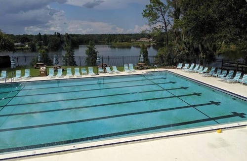 University House | Relaxing townhome with pool and lake