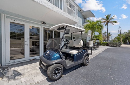 Rock Harbor Condo | Resort-style condo short walk from the ocean, includes golf cart.