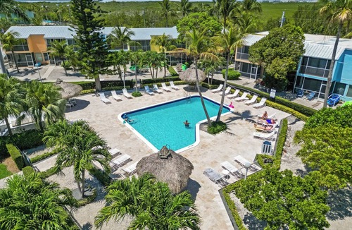 Rock Harbor Condo | Resort-style condo short walk from the ocean, includes golf cart.