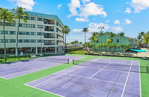 Rock Harbor Condo | Resort-style condo short walk from the ocean, includes golf cart.